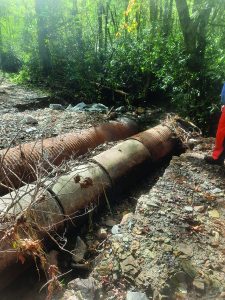 Exposed culverts blocked passage of Panther Creek Road.