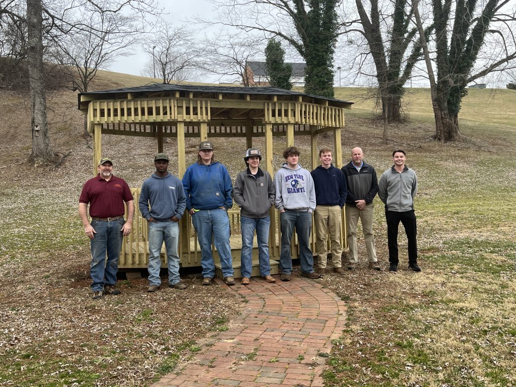 The Patrick County High School (PCHS) Building Trades II class, Patrick Building Supply employee Joe Aguilar, Building Trades II teacher Philip Steagall, and Parks & Recreation Director Luke Williams, attended Monday’s ribbon cutting on the new Hospice Memorial Garden Gazebo.