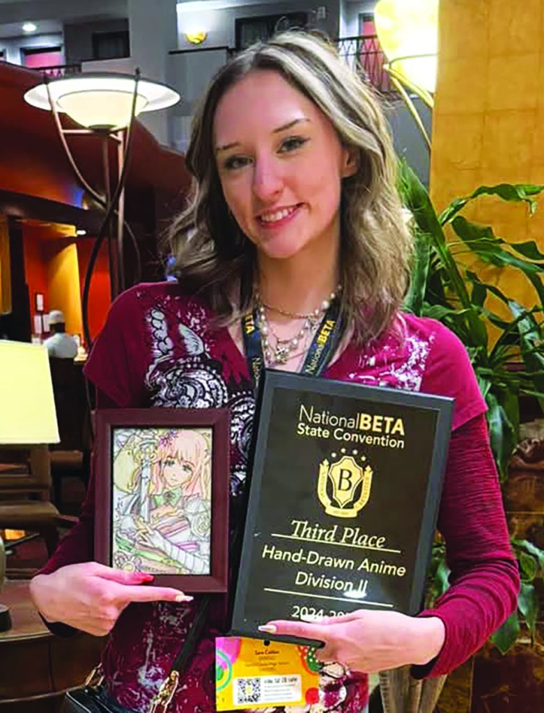 Tara Collins with her art work and award.