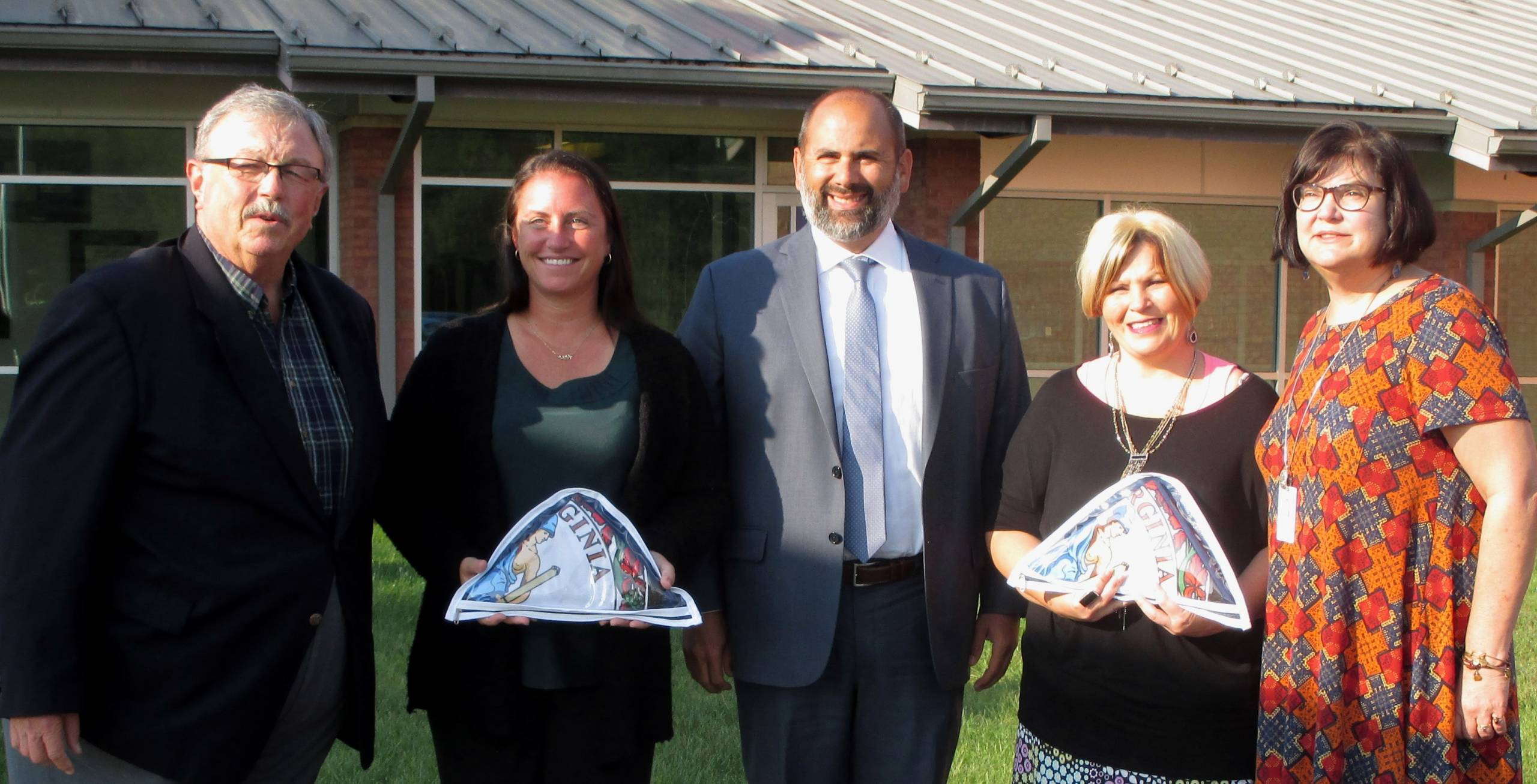 Habeeb presents flags to schools