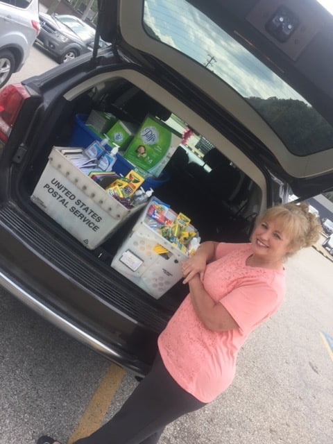 Poca Valley Bank donates school supplies to H.E White