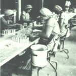 Workers affixing labels to baking powder cans at Rumford Chemical Works, East Providence.