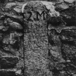 Photo of a turnpike milestone, southside of Smith St., 2 miles from center of Providence