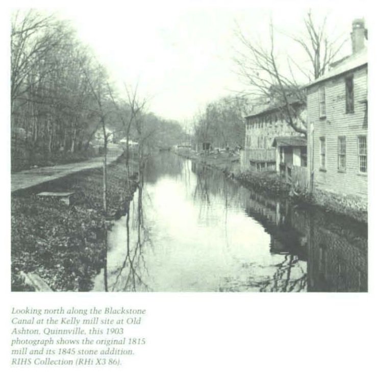 Looking north along the Blackstone Canal at the Kelly mill site at Old Ashton, Quinnville, this 1903 photograph shows the original 1815 mill and its 1845 stone addition.