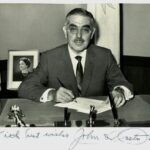 Black and white photograph of John O. Pastore with his signature across the bottom.