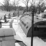 Arial photo of a row of Quonset Huts