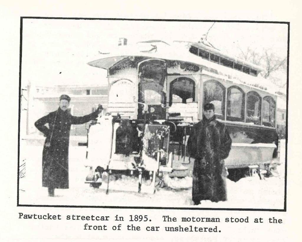 Image of two men in front of a streetcar, taken from the article.