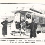 Image of two men in front of a streetcar, taken from the article.