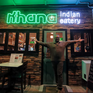 Khana Indian restaurant green and cool white neon sign