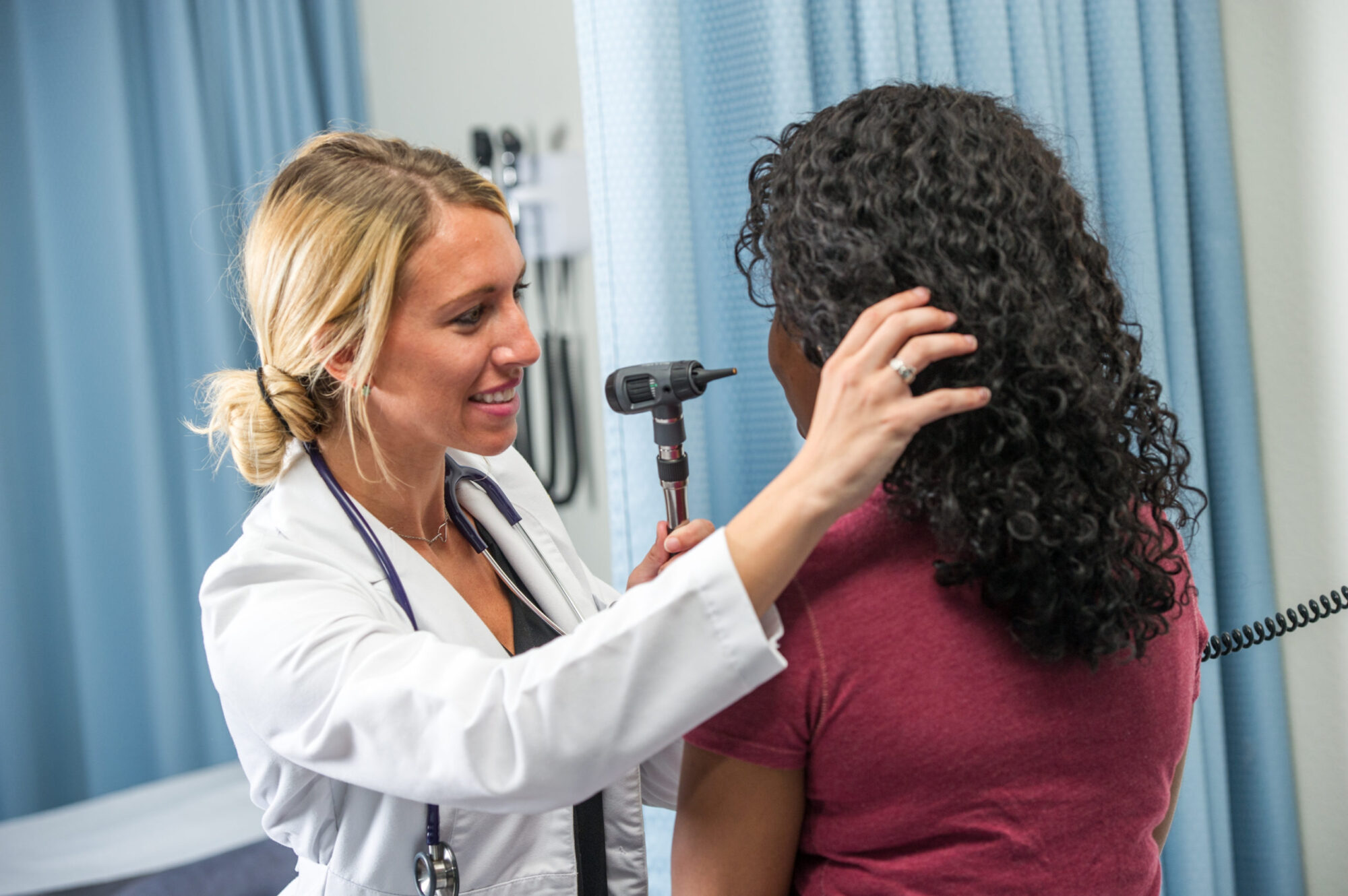 Nursing students evaluating a patient.