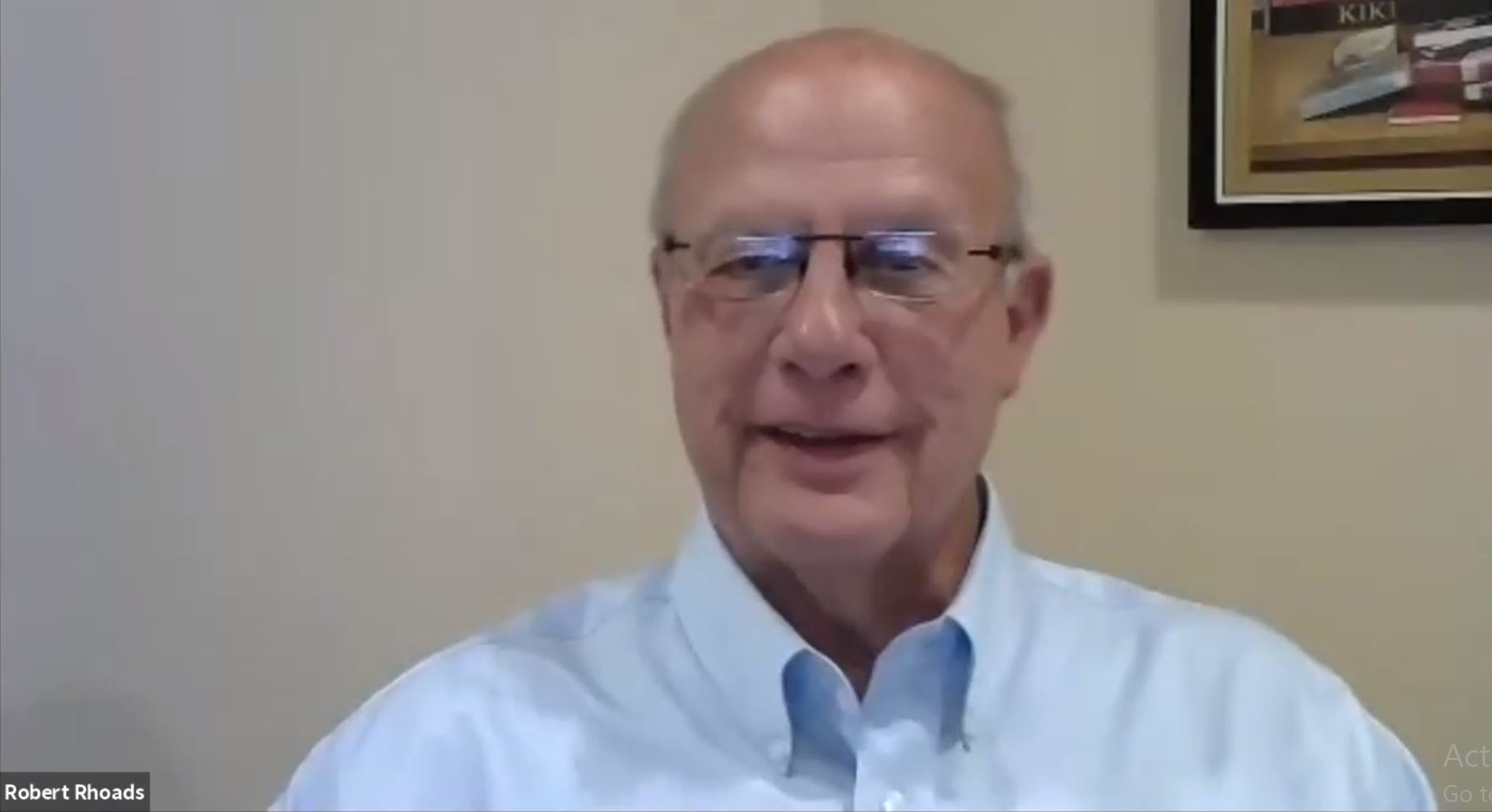 screen capture of older man wearing glasses