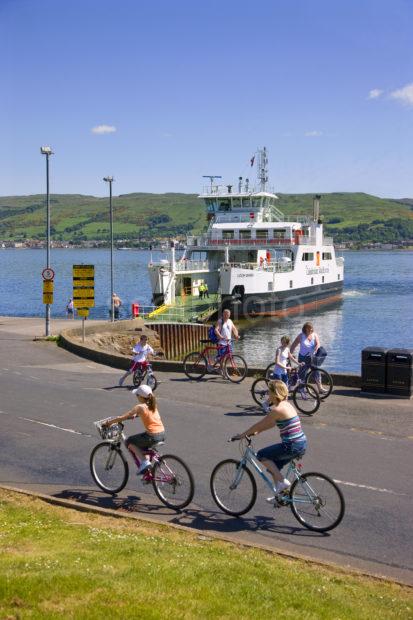 Cyclist On Cumbrae Island With Largs Ferry