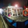 WY3Q3542 Boat Passes Through Dark Tunnel