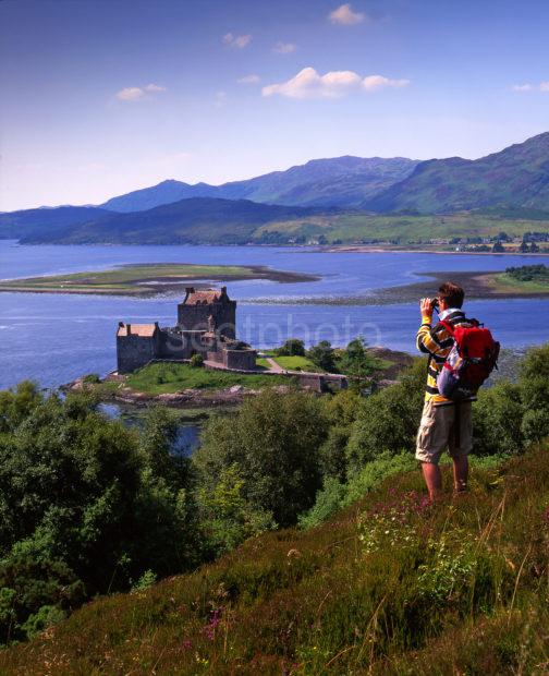 Hiker Overlooking Eilean Donan Castle