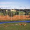 Looking Towards The Magnificent Palatial Stately Home Of Floors Castle As Seen From Across The River Tweed Roxburghshire