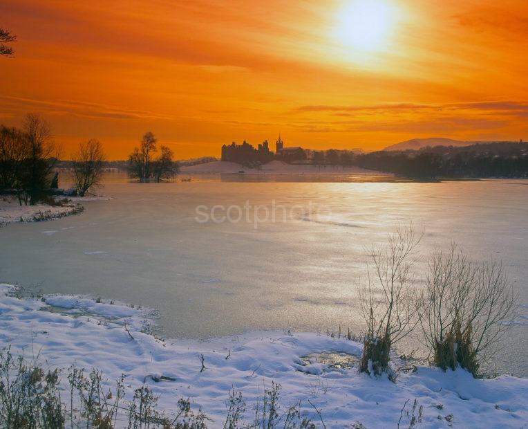 A Magnificent Winter Sunset Across Linlithgow Loch Towards Linlithgow Palace Linlithgow West Lothian