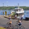 Cyclist On Cumbrae Island With Largs Ferry