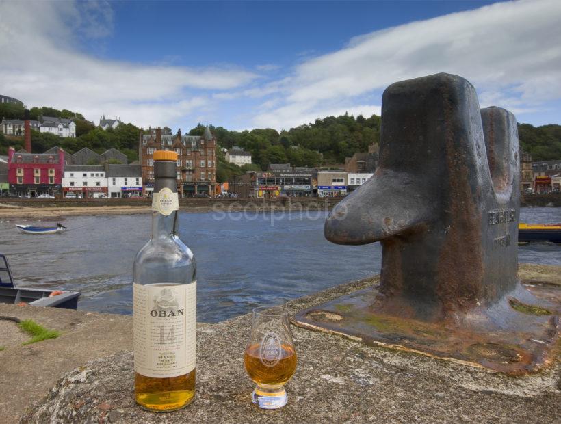 I5D1494 Oban Whisky On North Pier With Town Centre In View Oban