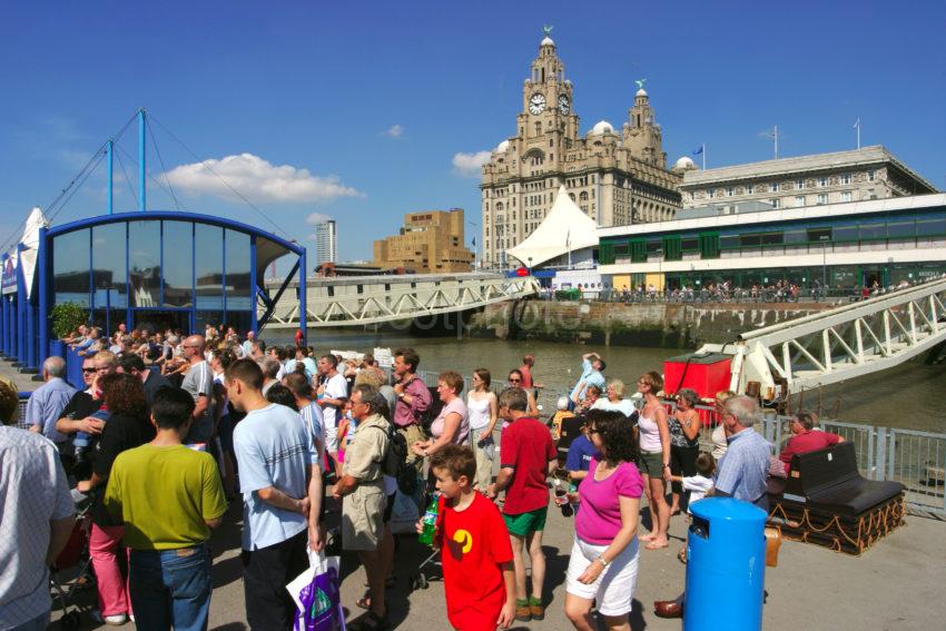 Tourist Await The Ferry At The Pier Head