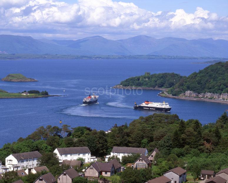 Two Ferries In Oban Bay With Dunollie Castle And The Morvern Hills Argyll