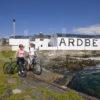 I5D0725 Two Visitors On Bikes At Ardbeg Distillery Islay