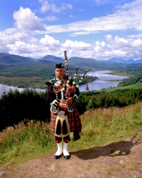 Piper Plays With Fantastic View Of Loch Garry