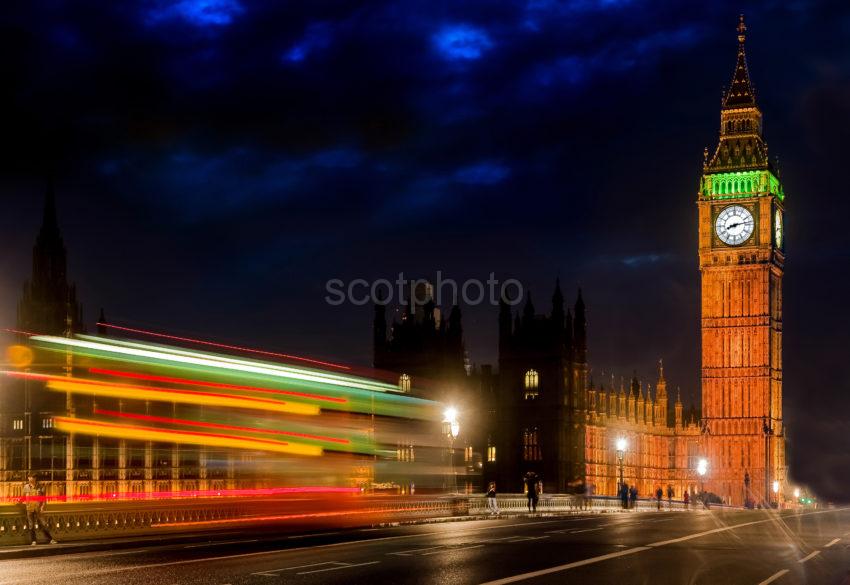 BIG BEN AND MOVING BUS AT DUSK