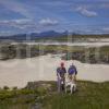 I5D6943 Tourist Walking Around Sanna Bay With Distant Rum Ardnamurchan