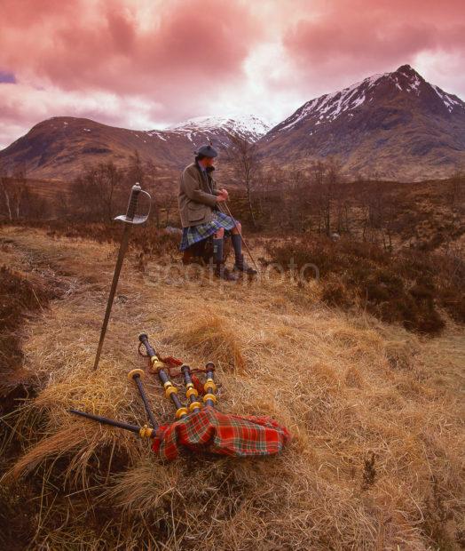 A Highlander Relaxes Amongst The Wild West Highland Scenery Glencoe West Highlands