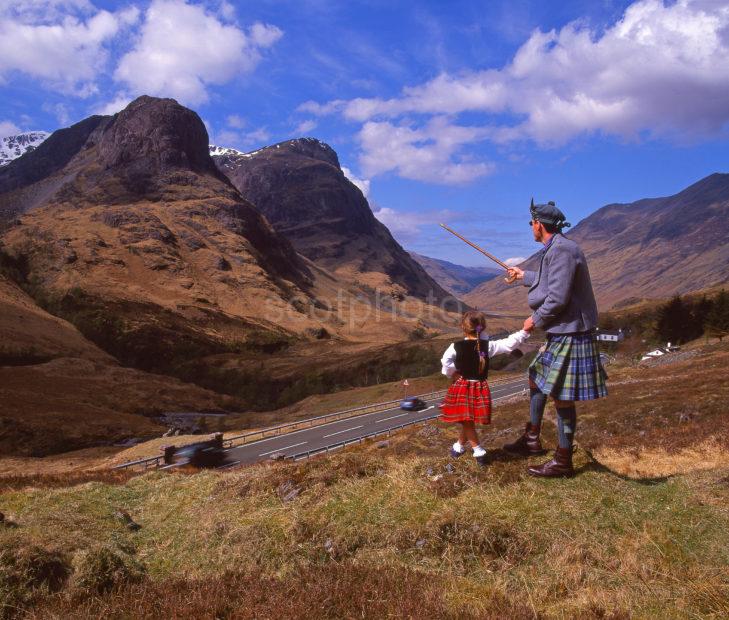 Highlander And His Small Friend Both Admire The Dramatic View Of The Pass Of Glencoe Before Their Eyes West Highlands