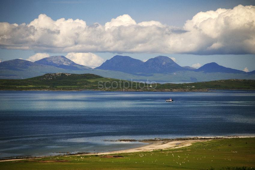 Gigha Ferry Crosses From Tayinloan With Paps Of Jura In View