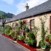 Summer Scene In Picturesque Luss Village Loch Lomondside Dumbartonshire