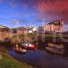 Evening Light Illuminates The Tiny Hamlet Of Blackwaterfoot On The Island Of Arran