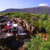 Walker Pauses For Rest Glencoe Waterfall