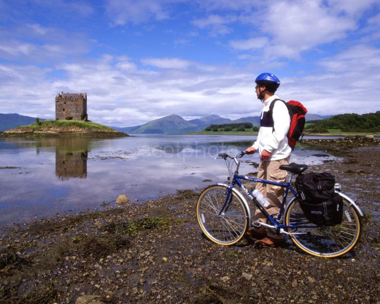 Cycling Nr Appin Argyll With Castle Stalker And Morvern Hills