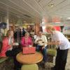 Passengers On Cal Mac Ferry With Laptop