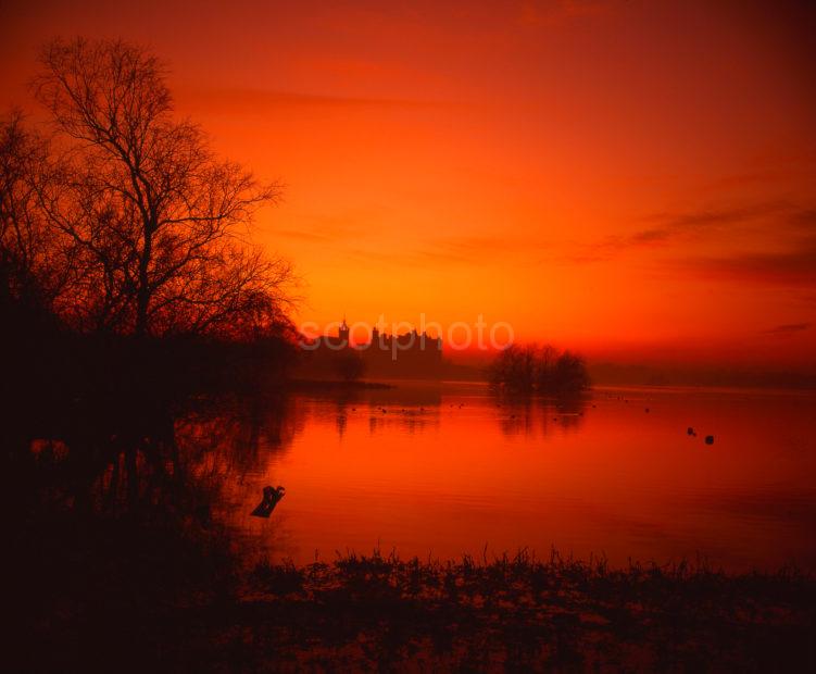 A Magnificent Sunset Afterglow Across Linlithgow Loch Towards The Palace West Lothian