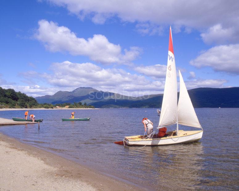 Yacht On Loch Lomond Near The Shore At Luss With Ben Lomond In View