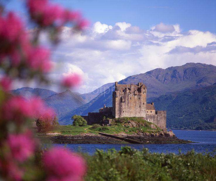 A Colourful Summer View Towards Eilean Donan Castle On The Shore Of Loch Duich