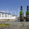 I5D0765 Ardbeg Distillery With Bottles Of Whiskey On Rocks