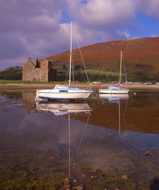 Peaceful Reflections At Lochranza With The Ruins Of Lochranza Castle Island Of Arran