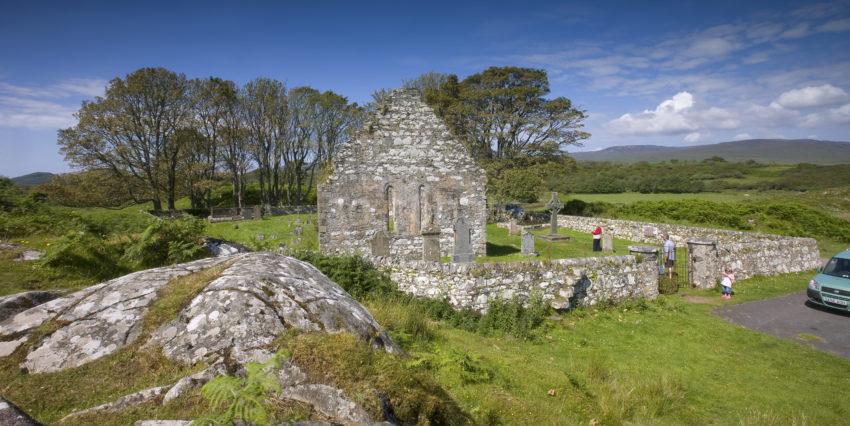 Tourists Visit Kildalton Chapel And Cross Islay