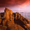 Sandstone Cliffs Bathed In Late Evening Light On The South Coast Of Arran With Pladda Isle In Distance Island Of Arran