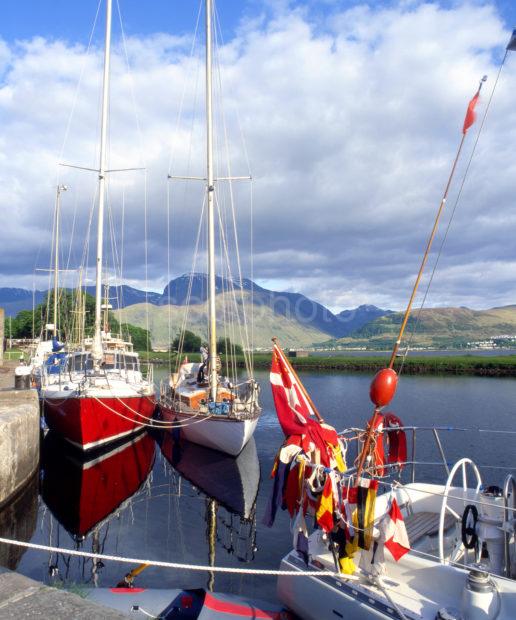 Yachts In Corpach Basin On The Caledonian Canal With Ben Nevis In View