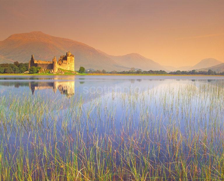 Peaceful Summer Reflections Of Kilchurn Castle On Loch Awe Argyll