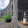 Oban Malt Whisky At Macaigs Tower Against Sun