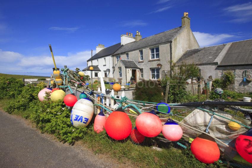 Houses On Tiree With Buoys