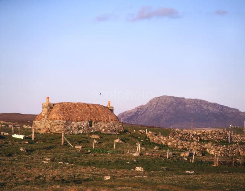 Thatched Croft And Ben Eaval From Baleshare North Uist Hebrides