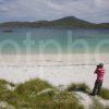 I5D9585 Tourist Looks At Castlebay From Beach On Vatersay Hebrides