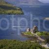 Y3Q0022 Portrait View Of Eilean Donan With Speedboat